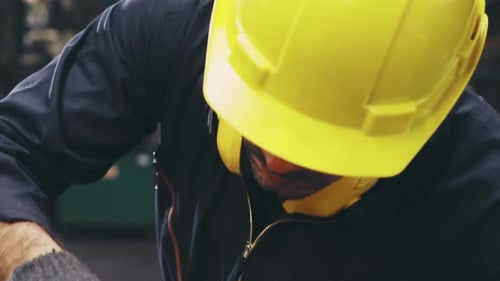 Smart Factory Worker Using Machine in Factory Workshop
