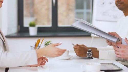 Colleagues Collaborating and Planning Together in Office