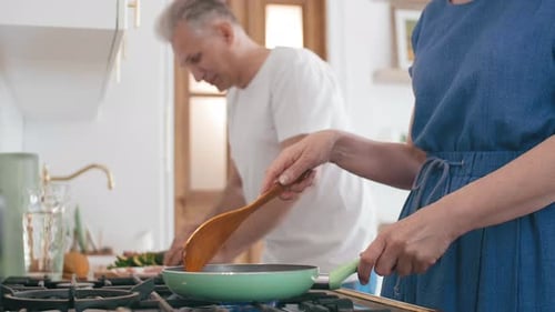 Couple Cooking Together in a Bright Modern Kitchen