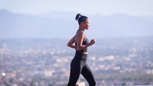 Mixed ethnicity woman Exercising in a park in Los Angeles