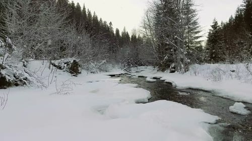 AERIAL: Flight Over the River in Winter