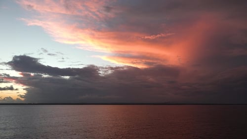 Sky with clouds over the sea during sunrise in cloudy weather on the Caribbean islands.