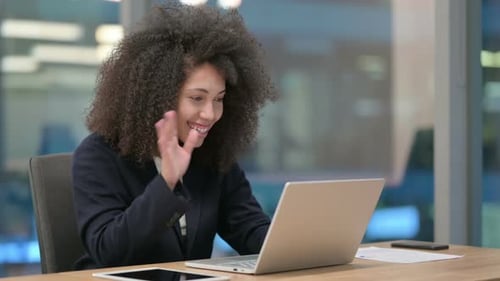 Woman in Business Suit Talking on Video Call