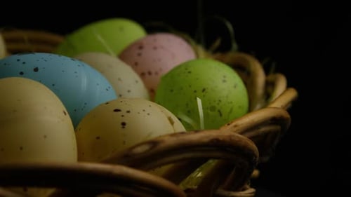 Pastel Easter Eggs in Wicker Basket Close Up