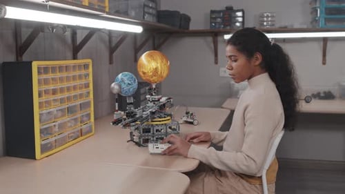Black Girl With Her Robotic Project