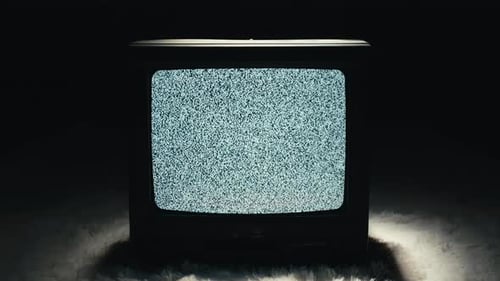 Retro Television Showing Static and Noise in Dark