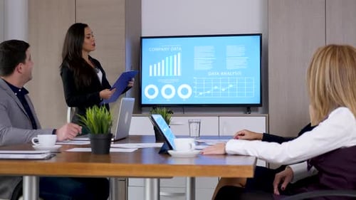 Business Presentation with Data Charts at Modern Workplace