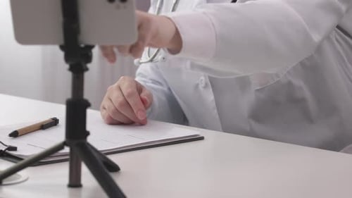 Health Professional Gives Consultation Through Mobile Device