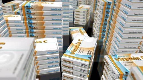 Vitamin C pills in box packs loop