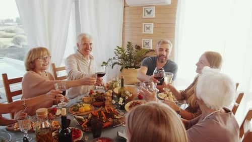 Family Celebrates with Festive Meal Together Indoors