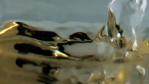 Ice Cubes Dropping Into Viscous Liquid Macro