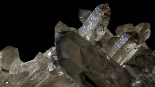Mountain Quartz Crystal . Rotates on a Black Background. Macro