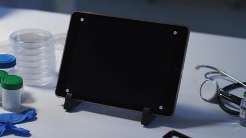 Tablet computer on stand on a desk at a doctors surgery