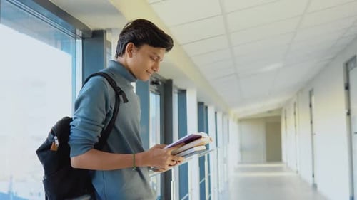 Indian Student with a Books in the University or College