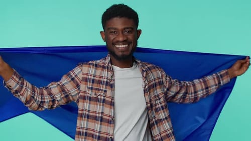 Young Adult Smiles Holding European Union Flag