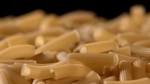 Close up of uncooked tube shaped pasta