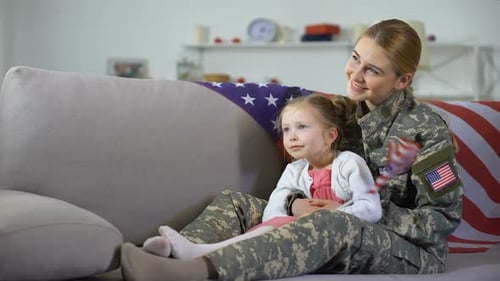 Woman in Military Uniform with Child Holding Flag