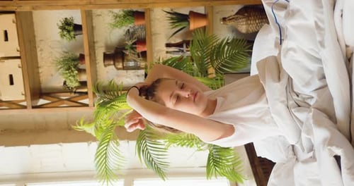 Woman Wakes Up and Puts Hair in Bun