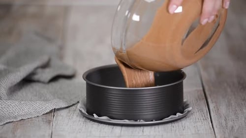 Pouring Cake Batter Into a Baking Pan