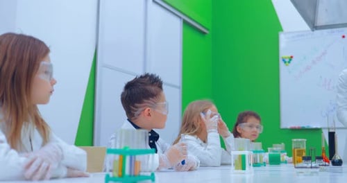 Children Enjoying Science Lesson in Bright Classroom