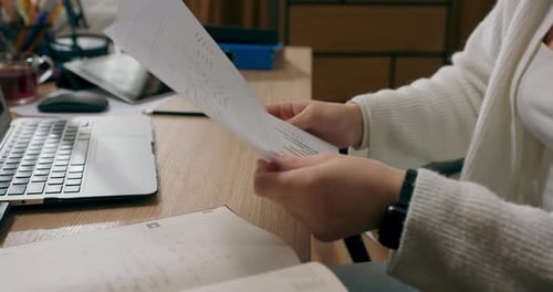 Young Woman Works with Financial Documents at Home Prepares Schedule