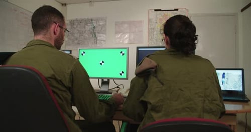 People Working at Computers in an Office Environment