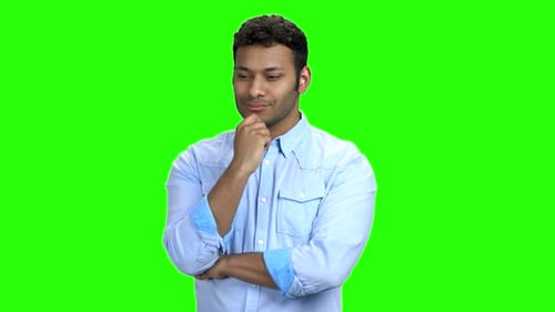 Young Handsome Man Is Thinking on Green Screen