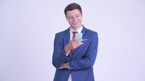 Young Adult Man Using a Cell Phone