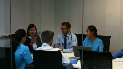 Medical Staff Meeting in Modern Conference Room