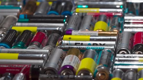 Pile of Used Batteries for Recycling and Disposal