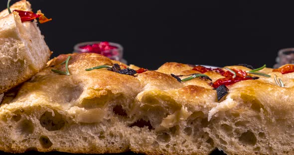 Homemade italian flat bread - Focaccia contorta. With olives, olive oil ...