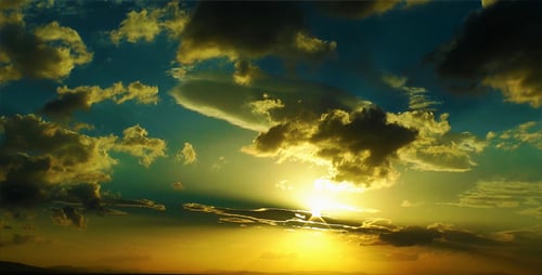 Aerial View of Sun Rays Through Clouds at Sunset
