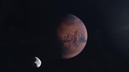 Mars en train d'être terraformée en un monde verdoyant avec les phobos lunaires en orbitant