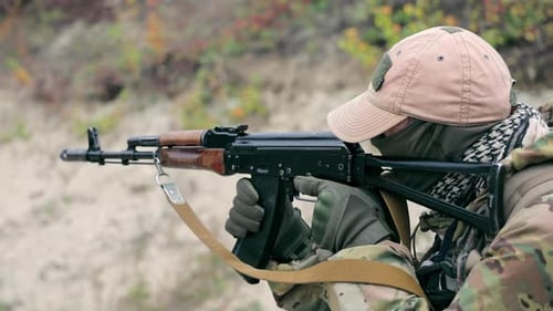 Military Shoots with a Machine Gun Close Up