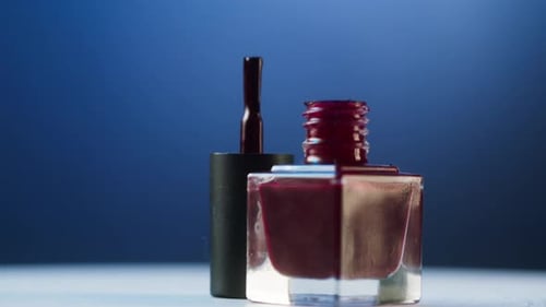 Bottle of Dark Red Nail Polish Still Life