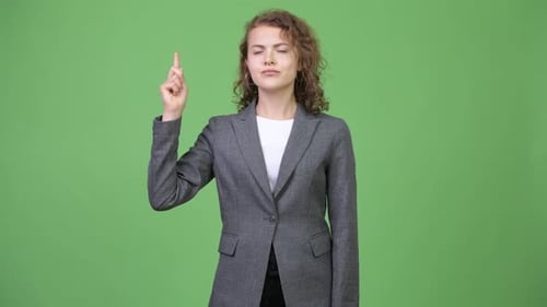 Woman Having an Idea in Front of Green Screen