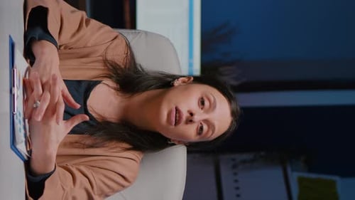 Woman in Office Having Video Call in Vertical Format