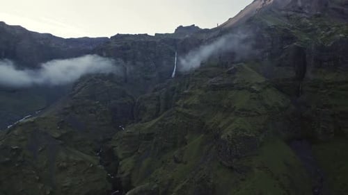 Stunning Waterfall Cascading Down Verdant Icelandic Mountain