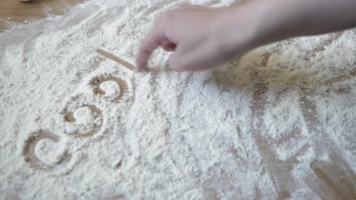 Finger Writes "Cooking" In Flour With Heart