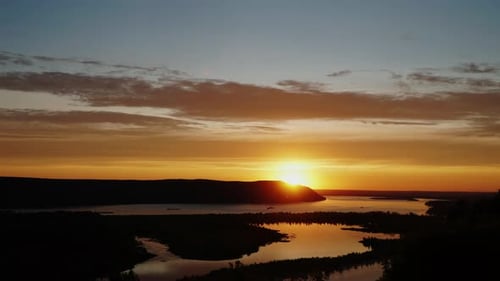 Timelapse of Sunset with Clouds and River When Color Changes From Orange to Red