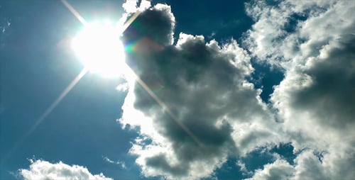Clouds Moving Across a Sunny Blue Sky