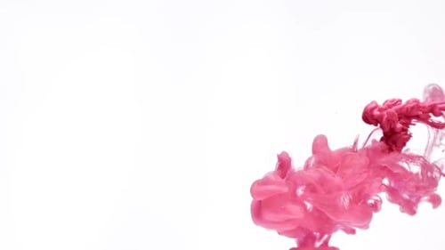 Pink Ink Swirling in an Abstract Cloud