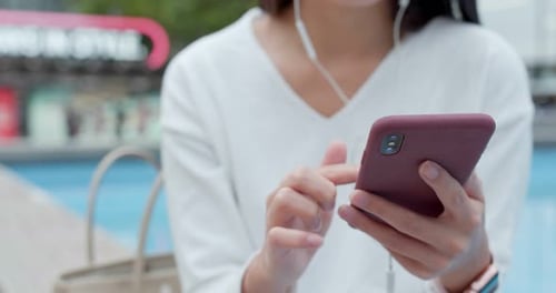 Woman use of mobile phone in city