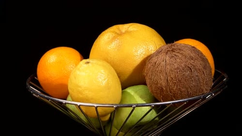 Bowl of Colorful Fruit on Black Background