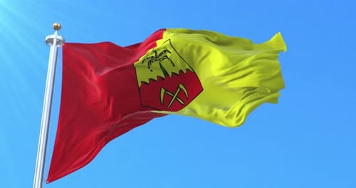 Realistic Red and Yellow Flag Waving with Stylized Crest Emblem