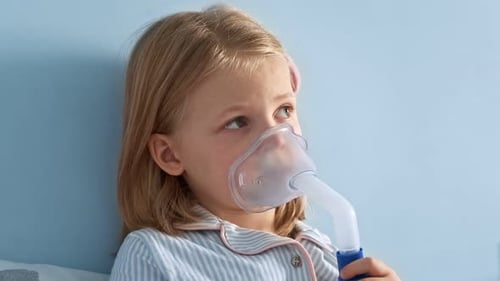 Young Child Using Nebulizer for Respiratory Treatment