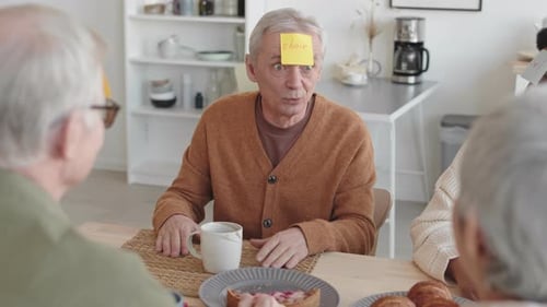 Adults Playing a Fun Guessing Game Indoors