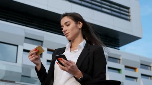 Young Adult Shopping Online with Mobile Phone