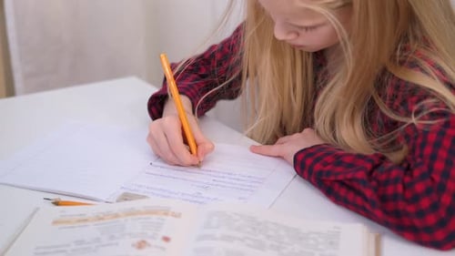 Blonde Schoolgirl Studying at Home Doing School Homework