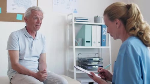Senior Man Consults Doctor in Bright Office